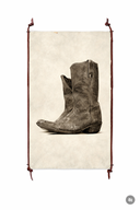 Vintage-style cowboy boot on a textured background with decorative frame