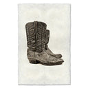 Pair of cowboy boots on a textured white background