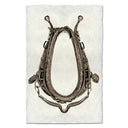 Horse collar with chain on a textured white background