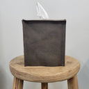 Brown with Burnished Black Leather Single Tissue Box Cover on a wooden stool against a plain background