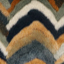Close-up of a textured fabric with a zigzag pattern in earthy tones.
