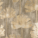 Close-up of a textured fabric with leaf pattern in beige and brown tones.