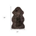 Brown fur rug with dimensions of 36x24 inches on a white background