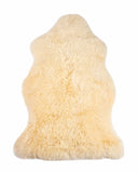 cream fur rug on a white background