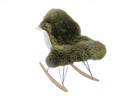 Rocking chair with a green fur cover on a white background