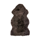 Brown new Zealand sheepskin rug on a white background