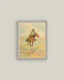 Framed artwork of a person riding a horse on a light gray wall