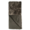 Folded blanket with textured edge on a white background