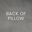 Text 'BACK OF PILLOW' on a textured gray background