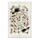A collection of various artificial fishing flies and lures arranged on a textured off-white rectangular background.