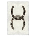 Two horseshoes arranged together on a textured white background