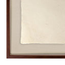 Framed artwork with a black frame and beige mat on a white background