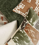 Knubby-Moss Pillow styled with multiple colorways including moss green, terracotta, and ivory with a geometric print pillow.