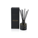 Apothecary Guild Opal Glass reed diffuser in cedar leaf and hinoki cypress, shown with dark gift box. textured glass reed diffuser vessel with black reeds.