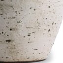 Close-up of a textured ceramic lamp base on a white background