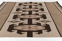 Adobe Brown Hand-Woven Rug
with geometric pattern on a plain background