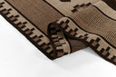 Brown and beige patterned rug on a white background