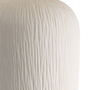 Close-up of a textured white surface on lamp base.
