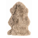 Beige sheepskin fur rug on a white background