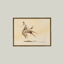 Framed artwork of a cowboy riding a horse on a beige background