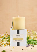 Lafco candle with chamomile and lavender on a beige background