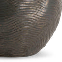 Close-up of a textured brown pot on a white background