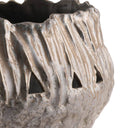 Close-up of a textured ceramic planter with a metallic silver and bronze finish, featuring vertical ridges and triangular cutouts, on a white background.
