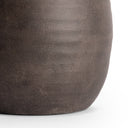 Close-up of a textured brown vase on a white background