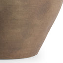 Close-up of a textured brown pot on a white background