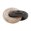 decorative chain link made of marble one cream and one black on a white background