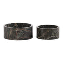 Two dark green marble bowls on a white background