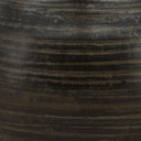 Close-up of a textured dark brown surface
