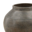 Close-up of a textured ceramic vase on a white background