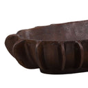 Close-up of a brown decorative bowl with texture on a white background