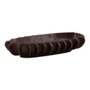 Decorative antique bronze bowl with wavy edge on a white background