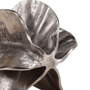 Close-up of an antique nickel aluminum decorative sculpture on a white background
