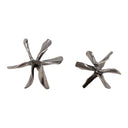 Pair of silver star-shaped decorative sculptures on a white background