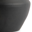 Close-up of a dark gray ceramic lamp base on a white background