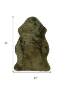 Green faux sheepskin rug with dimensions of 24x36 inches on a white background