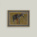 Framed western art print of a cowboy resting against a saddled horse against an olive green background, in a gray wood frame.