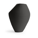 Black geometric vase on a white background
