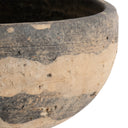 Close-up of a ceramic pot with a textured surface on a white background