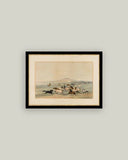 Framed artwork of a field of horses on a plain wall.