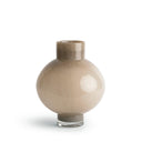 A small round glass vase with a wide bulbous body, a short cylindrical neck, and a clear glass base, shown on a clean white background.