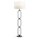 A modern floor lamp with a white drum shade and a dark metal frame featuring three stacked elongated oval links connected by small circular joints, standing on a round base against a plain white background.
