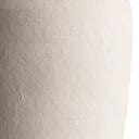 Close-up of a textured ceramic surface in a warm off-white or cream tone, showing subtle speckling and matte finish against a white background.