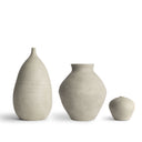Three matte ceramic vases in different shapes and sizes, displayed on a clean white background.