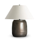 Graham Table Lamp with a textured ceramic bronze base and white shade on a white background