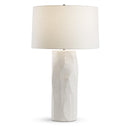 Grosseto Table lamp with a textured white base and a white shade on a white background