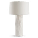 Grosseto Table lamp with a textured white base and a white shade on a white background